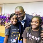  Dr. Robert Taylor with two elementary students